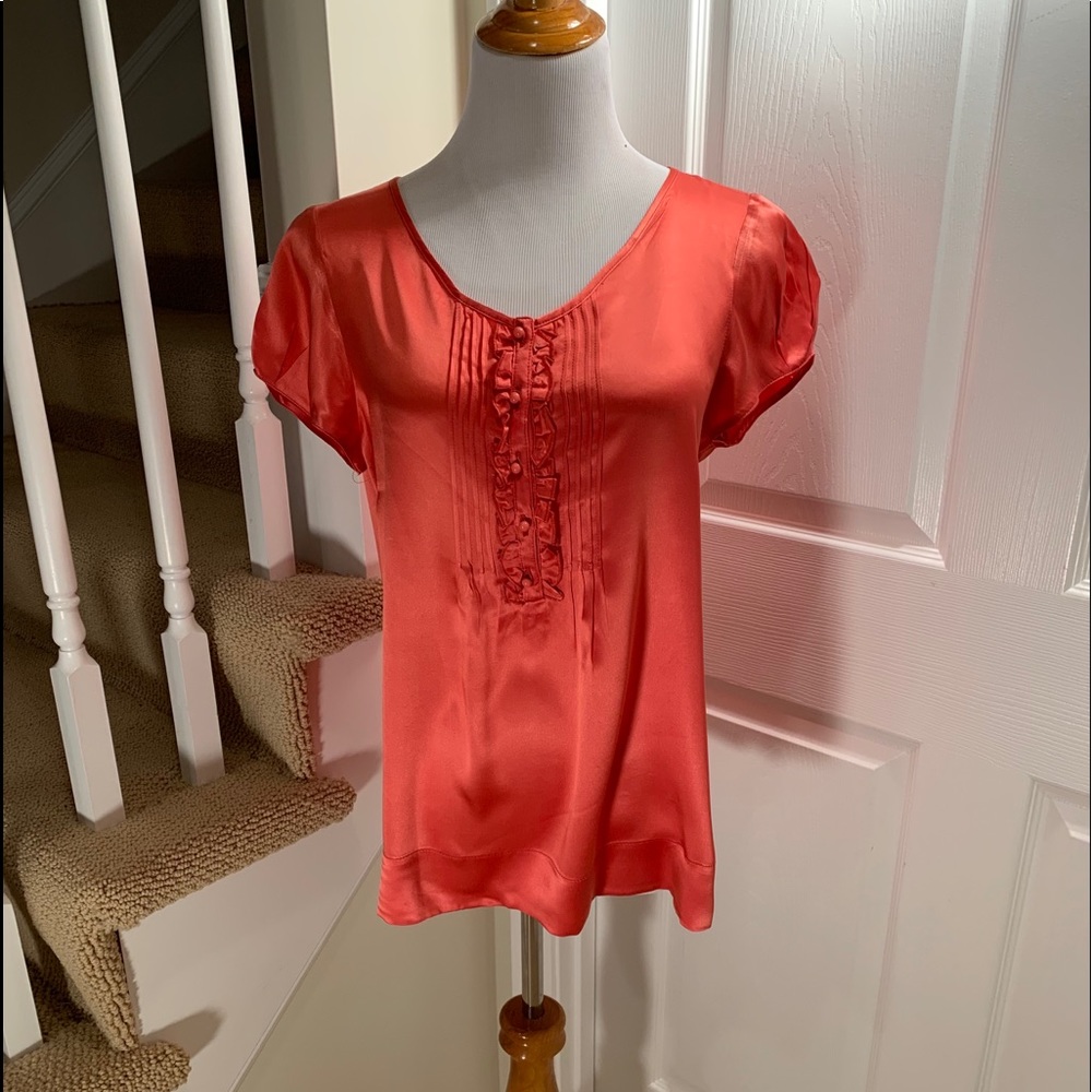 Red silk blouse with ruffles. Short sleeves